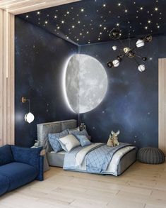 a bedroom decorated in blue and white with stars on the ceiling, moon wall mural