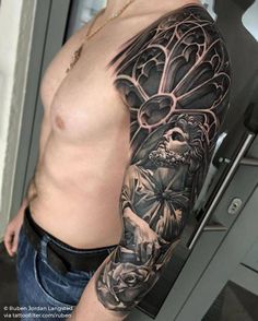 a man's arm with an angel and flowers tattoo on the left side of his body