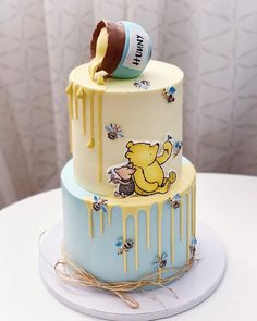 a winnie the pooh cake with honey dripping on it