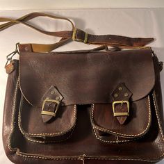 Euc - Excellent Condition One Large Inside Pocket Two Outside Pockets Buckle Closure Adjustable Removable Strap Beautiful Rustic Bag Vintage Brown Satchel With Brass Hardware For Daily Use, Leather Shoulder Bag With Detachable Strap For School, Leather Shoulder Bag With Removable Pouch For School, Leather Satchel In Vintage Brown With Brass Hardware, Brown Flap Shoulder Bag With Brass Hardware, Vintage Brown Leather Satchel With Brass Hardware, Leather Satchel With Brass Hardware For Daily Use, Leather Saddle Bag With Detachable Strap For School, Brown Flap Bags With Brass Hardware