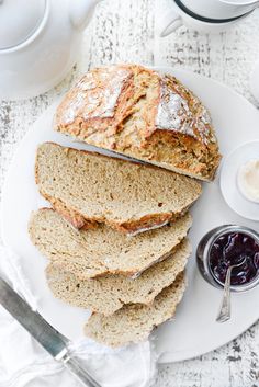 slices of bread on a plate with jam and butter