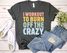 Workout shirt I Workout to Burn Off the Crazy Shirt Funny Workout shirt with Sayings for Women gym shirt mom shirt I Workout To Burn Off The Crazy Racerback Tank, Gym Tank, Fitness Tank, Workout Clothing, Funny Workout Tank, Funny Gym Shirt, Workout Shirt I Workout to Burn Off the Crazy Shirt - Unisex T Shirt, Women Racerback Tank, Long Sleeve T-Shirt Tees Tshirt Sweatshirt Sweater Hoodie Gift For Men Women Boys Girls Well, let's say goodbye to all this boring apparel... The GodBlessThisDesign team creates custom clothes with great designs to suit all tastes. Our unique and blessed designs are a blast fit for every occasion and always a perfect fit... We combine our beautiful designs with high quality apparel like no one has ever done before. There's nothing worse than being charmed by a n Sporty Tops With Funny Text For Workout, Sporty Workout Tops With Funny Text, Cotton Tops With Funny Text For The Gym, Casual Sports Tops With Funny Text, Pre-shrunk Casual Gym Shirt, Casual Pre-shrunk Workout Shirt, Cotton Workout Shirt With Letter Print, Sayings For Women, Funny Gym Shirt