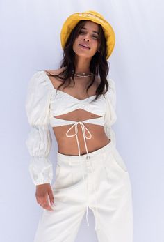 The She's A Muse Top features cut out tie detail, cropped body and long puff tiered sleeve. Wear with our 90'S Slouchy Jeans In Cream! Color: Cream Cut Out Detail Long Puff Tiered Sleeve Cut Out Front Tie Detail Cotton/Linen Model Wearing Small Summer Brunch Puff Sleeve Top With Lantern Sleeves, Chic Crop Top With Blouson Sleeves, Fitted Crop Top With Lantern Sleeves For Spring, Trendy Puff Sleeve Crop Top For Spring, Spring Trendy Puff Sleeve Crop Top, Fitted Lantern Sleeve Crop Top For Spring, Trendy Summer Puff Sleeve Top With Balloon Sleeves, Chic Balloon Sleeve Crop Top For Summer, Trendy Cropped Puff Sleeve Top For Day Out