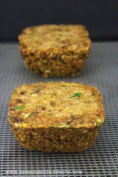 two pieces of food sitting on top of a cooling rack next to each other in front of a black background