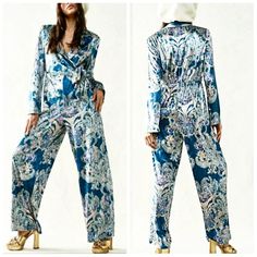 *This Brand New Jumpsuit By Free People Is Absolutely Gorgeous! It Is Made Of A Soft Velvet Material, With An Intricate Floral Design. It Is Blue, With Hints Of Pale Pink, Purple, And Green. The Upper Portion Has A Wrap Cross Front, With A Waist Tie. It Has A Collar, Shoulder Pads, And Long Sleeves. It Is Half Lined, And Has A Back Elastic Waist, Which Makes It Very Flattering To Your Backside. This Jumpsuit Is Beautiful, And Would Be Perfect For So Many Occasions!* Fitted Jumpsuits And Rompers For Pajama Party, Blue Long Sleeve Spring Pantsuit, Wrap Jumpsuit, Purple And Green, Velvet Material, Free People Pants, Soft Velvet, Waist Tie, Pale Pink