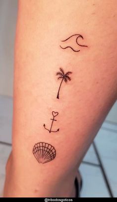 a woman's leg with a small tattoo on it, and a palm tree