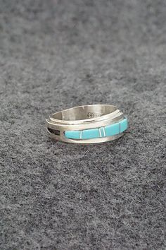 This turquoise and sterling silver inlay ring was made by Navajo silversmith Wilbert Muskett Jr. The inside of the band is signed M and stamped sterling.Size: 6Length: 1/4"Free shipping on all orders! We ship with USPS and always include tracking. All orders ship within a day of payment.Returns are accepted up to 30 days after you receive your order. Just send us a message. Our shop offers cash back or store credit. The item must be returned in new condition. Anniversary Turquoise Inlay Ring In Sterling Silver, Bear Carving, Squash Blossom, White Buffalo, Pearl Chain, The Band, Native American Jewelry, Turquoise Sterling Silver, Free Jewelry