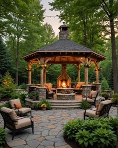 an outdoor gazebo with seating around it