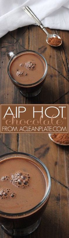 two bowls filled with hot chocolate on top of a wooden table