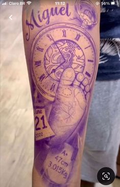 an arm with a tattoo on it that says angel and has a clock in the middle