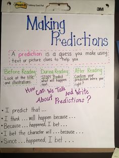 a white board with writing on it that says making predicates next to a laptop