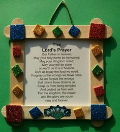 the lord's prayer is displayed on a green background with wooden pegs and magnets