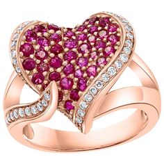 A classic, Cocktail ring 2 Ct Ruby & 0.75 Ct Diamond 18 Karat Rose Gold Heart Shape Ring Ruby approximately 2 ct Diamonds approximately 0,75 ct. All round brilliant cut diamonds 18 Karat Rose Gold: 9.2 Grams Stamped for 750 Ring Size 8 ( can be altered ) This ring is on clearance and is priced very competitively. It's a vintage piece with gold frame work, adding to its charm and value. While the pictures are from a phone and not professional, the actual piece is even prettier in person. If you need the ring resized, it can be done for free of charge, but once it's resized to your size, it cannot be returned. FOLLOW MonalisaJewelry Inc. storefront to view the latest collection. We encourage you to take a look at all the pictures provided for this item. As it can be difficult to capture the Heart Shape Ring, Frame Work, Ring Ruby, Classic Cocktail, Rose Gold Heart, Heart Shaped Rings, Ruby Rose, Ruby Ring, 2 Carat