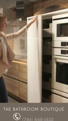 a woman is standing in front of an oven with the door open and she has her arms out