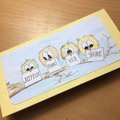 three birds sitting on top of a wooden table next to a yellow envelope with the words foxflix, ferme and share