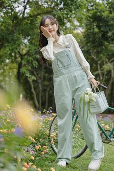 Fresh apple green denim overalls with a flower embroidered bib, button up sides, side pockets and back pockets. S: 32" waist, 39" hips, 23" thighs, 17" ankles, 24.5" inseamM: 33.5" waist, 40.5" hips, 24" thighs, 17.5" ankles, 24.5" inseamL: 35" waist, 42" hips, 25" thighs, 18" ankles, 24.5" inseam How to attach buckles:Slide the rectangular buckle on first, followed by the T-shaped buckle. Overall straps will hold on its own as such or you can slide the free end back into the rectangular buckle. Overalls Outfit Cottagecore, Girly Overall Outfits, Green Cotton Jeans For Spring, Trendy Bib Front Overalls For Spring, Green Bib Front Overalls With Pockets, Green Cotton Overalls, Trendy Green Cotton Overalls, Trendy Green Overalls With Pockets, Green Bib Front Overalls For Summer