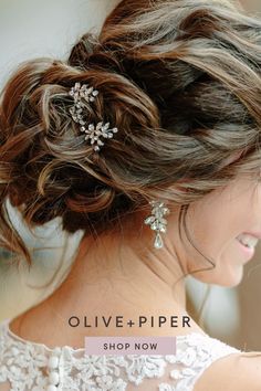 a woman wearing a wedding hair comb with flowers on it's head and the words olive - piper shop now