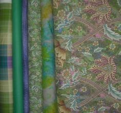 four different colored fabrics are lined up together