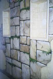 there is a wall made out of stone blocks