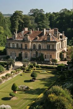 a large house with lots of trees in front of it