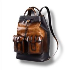 Like New, Gently Used! A Sophisticated, Sleek And Modern Vision Of The Classic Backpack H 16.9 In / L 12.6 In / W 5.7 In Hand Painted Mid Brown Patina Premium Leather Construction Limited Time Free Shipping Within U.S. Luxury Large Capacity Standard Backpack, Luxury Large Capacity Shoulder Backpack, Elegant Leather Backpack With Large Capacity, Luxury Shoulder Bag With Leather Handles In Backpack Style, Luxury Soft Leather Satchel Backpack, Designer Brown Backpack Bags, Designer Brown Standard Backpack, Luxury Brown Backpack For Daily Use, Modern Brown Leather Backpack With Adjustable Strap