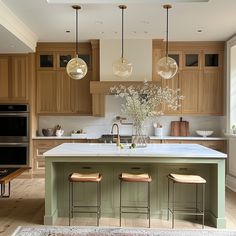 a large kitchen with wooden cabinets and white counter tops