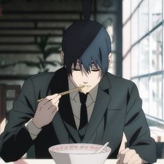 an anime man eating out of a bowl with chopsticks in his hand while sitting at a table