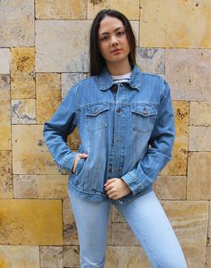 Vintage blue jean jacket in a mid wash denim. Boyfriend style. Two chest pockets. Size medium, UK 10-14 / EU 38-42. Measurements - 40"(102cm) bust - 26"(66cm) sleeve length - 25" (64cm) jacket length. Material - Denim. Condition - Good, wear to arm as shown . Handpicked, repaired and ready to wear. This is an original vintage item, not new and minor signs of wear & age are expected, we will highlight any major flaws. Model is a UK 6/8 and is 5'7" tall Washed Blue Denim Jacket With Pockets, Washed Blue Recycled Denim Jacket With Pockets, Relaxed Fit Denim Vest With Pockets, Recycled Denim Light Wash Long Sleeve Jacket, Light Wash Relaxed Fit Denim Jacket In Recycled Denim, Light Wash Relaxed Fit Recycled Denim Jacket, Relaxed Fit Light Wash Recycled Denim Jacket, Relaxed Fit Denim Jacket In Recycled Denim, Fall Medium Wash Recycled Denim Jacket