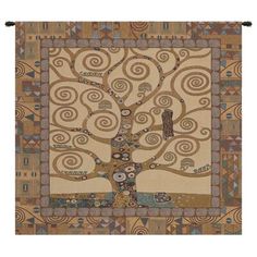 the tree of life tapestry is hanging on a wall