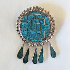 Vintage Native American made, signed by the highly skilled artist, brooch that can also be worn as a pendent. The brooch has age related wear so please make sure to view the pics close up. This intricate brooch consists of inlaid turquoise and sterling silver. Turquoise Cabochon Brooch As A Gift, Turquoise Cabochon Brooch For Gift, Artisan Collectible Jewelry Brooch, Handmade Vintage Turquoise Brooches, Unique Handmade Turquoise Brooch, Handmade Turquoise Brooches For Collectible, Unique Handmade Turquoise Brooches, Turquoise Brooch Jewelry Gift, Handmade Turquoise Brooches As Gift