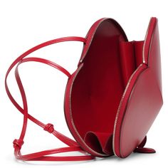 Red leather crossbody bag from Alaïa. The Le Coeur bag has the shape of a heart, features a zipped top and hangs from an adjustable shoulder strap.Measurements: L21 x H17 x W5 cmMade in Italy Alaia Bag, Heart Aesthetic, Heart Shaped Bag, Retro Bags, Heart Bag, Bag Ideas, My Wardrobe, Hanging Bag, The Shape