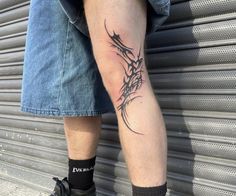 a man with a tattoo on his leg