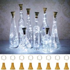 several glass bottles with lights in them are shown next to each other, and the same one has a ring on it