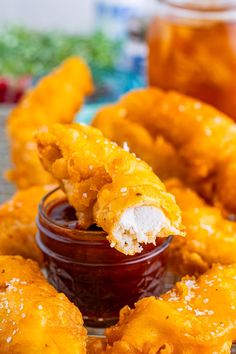 some fried food on a plate with dipping sauce