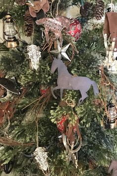 a christmas tree with ornaments on it and an ornament in the shape of a horse