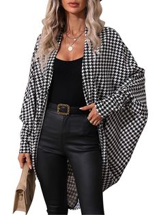 a woman wearing a black and white checkered jacket with high waist, leather pants and heels