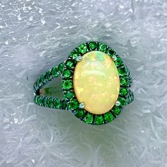 Natural Quality Opal Tsavorite Ring Size 7 14k Gold 5.66 TCW Certified $5,950 300686This is a one of a Kind Unique Custom Made Glamorous Piece of Jewelry!Nothing says, “I Love you” more than Diamonds and Pearls!This item has been Certified, Inspected, and Appraised by Gemological Appraisal LaboratoryGemological Appraisal Laboratory of America is a proud member of:- GIA Alumni Association- National Association of Jewelry Appraisers- International Consortium Gem-Testing Laboratories- Gemological A Oval Tsavorite Rings With Halo Setting, Oval Multi-stone Emerald Ring, Oval Multi-stone Tsavorite Rings, Oval Tsavorite Multi-stone Ring, Gia Certified Green Tsavorite Rings, Green Multi-stone Opal Anniversary Ring, Green Multi-stone Opal Ring For Anniversary, Tsavorite Ring, David Yurman Ring