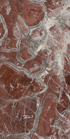 an image of marble that looks like it has been painted red and grey with white streaks