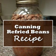 a jar filled with peanuts sitting on top of a counter