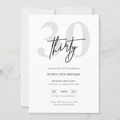 a white birthday party card with the number twenty on it's front and back