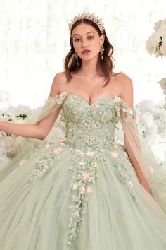 Get ready to be the belle of the ball in this enchanting Sage Quinceanera ball gown! This gorgeous gown is perfect for any young girl celebrating her special day in classic style. Its strapless bodice has been adorned with stunning floral and lace applique that make this dress utterly captivating. The blush pink floral accents give it a dreamy, feminine look that's sure to dazzle any crowd, while its off-the-shoulder tulle sleeves add an extra touch of romance. And with its elegant lace up corse Sage Quinceanera, Floral Ball Gown, Cape Sleeve Dress, Cinderella Divine, Tulle Sleeves, Quinceanera Dress, Corset Back, Prom Girl, Cape Dress