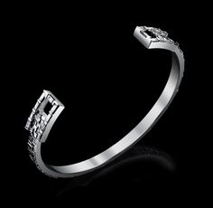 Our Signature Collection Cuff Bracelet in Solid 18K White Gold with baguette cut diamonds. 1.3 Carats. VS+ Clarity. F+ Color. Luxury Baguette Diamond Bangle For Formal Events, Luxury Bangle With Baguette Diamonds, Luxury Baguette Cut Bangle For Formal Occasions, Silver Baguette Cut Bangle For Formal Occasions, Baguette Cut Diamond, Baguette Cut, 3 Carat, Signature Collection, Bracelet Sizes