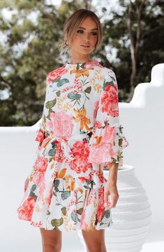 Vibrant oversized blooms bring the garden to the party in this belted dress made for sashaying with its ruffled bell sleeves and flouncy tiered skirt. 37" length Hidden back-zip closure Mock neck Three-quarter sleeves Removable sash Unlined 100% rayon Hand wash, line dry Imported Floral Print Short Dress, Printed Short Dresses, Mid Length Sleeves, Half Sleeve Dresses, Pink Prom Dresses, Floral Print Shorts, Tiered Dress, Peta, Spring Dresses