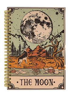 a spiral notebook with an image of the moon and trees on it, in front of a full moon