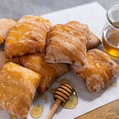 some pastries and honey on a table