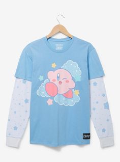 The adorable pink puffball is ready to bring some adorable style to your wardrobe with this long sleeve tee! This layered shirt features a portrait of Kirby among clouds on the front with allover star print sleeves  perfect for adding some galactic fashion to your look.A BoxLunch Exclusive!60% cotton; 40% polyesterListed in unisex sizesWash cold with like colors; dry lowDo not iron over printImported Galactic Fashion, Layered Long Sleeve T Shirt, Bee Costume, Kawaii Shirts, Box Lunch, Layered Long Sleeve, Kawaii Fashion Outfits