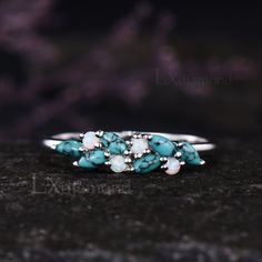 Item description ✦ Handmade, high-quality item! ✦ Material: 925 sterling silver, Solid 10k/14K/18K GOLD (can be made in white/rose/yellow gold) Wedding band ✦ Gemstones: 2x4mm Marquise Cut Natural Turquoise and 2mm Round Cut Lab Opal Any ring size can be made,if the ring size is not in the option list ,contact me. As it is handmade,it needs 2-4 weeks to finish and then be shipped by usps or DHL. Return policy: We offer 30 days return policy. For any reason, if you are not completely satisfied with your order, you may return it for a refund. Buyer is responsible for the handcraft fee (15%-30% of the total price) and the return shipping cost. Turquoise Multi-stone Round Opal Ring, Turquoise Multi-stone Promise Ring Jewelry, Silver Turquoise Ring With Accent Stones For Weddings, Gift Turquoise Cluster Ring With Gemstone, Multi-stone Turquoise Ring For Anniversary, Fine Jewelry Multi-stone Turquoise Ring For Anniversary, Silver Turquoise Ring For Wedding, Silver Turquoise Wedding Ring With Gemstone, Anniversary Sterling Silver Multi-stone Turquoise Ring