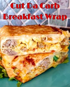 a close up of a sandwich on a plate with the words cut da carb breakfast wrap