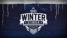 the winter stingers logo is displayed in front of an audience