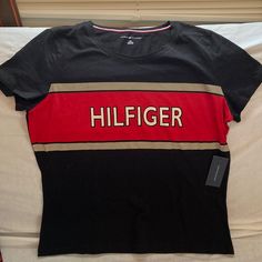 Large Woman Tommy Hilfiger T-Shirt Red, Bage And Black, With Front Logo Tommy Hilfiger Sporty Black Tops, Tommy Hilfiger Black Crew Neck Top, Tommy Hilfiger Black Crew Neck T-shirt, Trendy Red Tommy Hilfiger Top, Casual Red Tommy Hilfiger T-shirt, Tommy Hilfiger Red Crew Neck Top, Tommy Shirt, Tommy Hilfiger Baby, Tommy Hilfiger Top